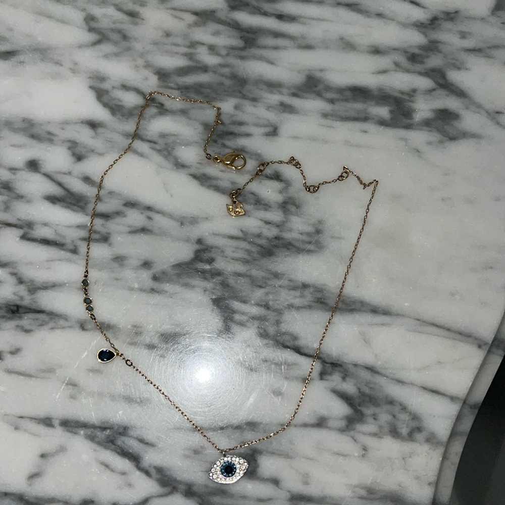 Woman’s evil eye necklace